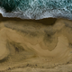 An aerial photo shows the closed beach after oil washed up on Huntington Beach, Calif., on Monday, Oct. 4, 2021.